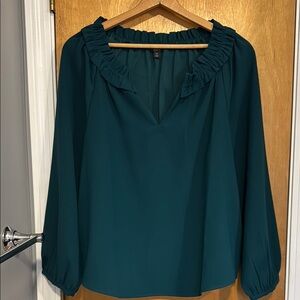 Dark green long sleeve blouse by J Crew. Excellent condition.